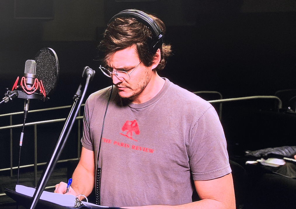 Pedro Pascal in a The Paris Review T-Shirt Reading VO for Disney Galery: The Mandalorian, Episode 3 [Source: Disney Plus]